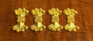 A set of Eight Lead Gold Leaf Appliqués