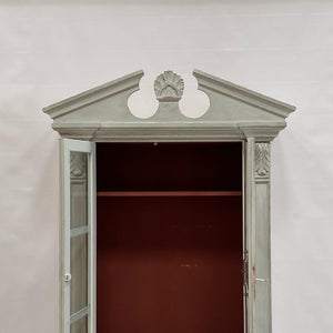 A painted book case or cabinet