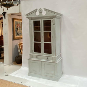 A painted book case or cabinet
