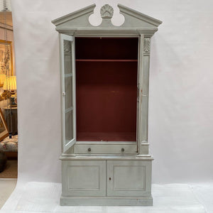 A painted book case or cabinet