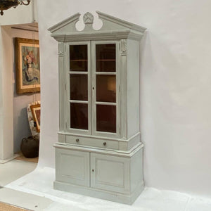 A painted book case or cabinet