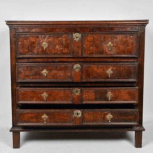 An oak and walnut chest of drawers