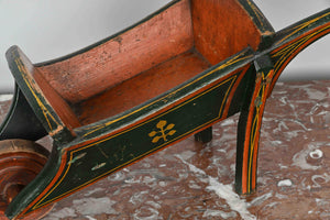 Small painted wooden wheelbarrow
