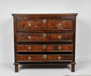 An oak and walnut chest of drawers