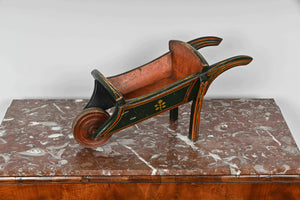 Small painted wooden wheelbarrow