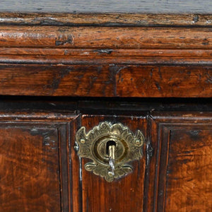 An oak and walnut chest of drawers