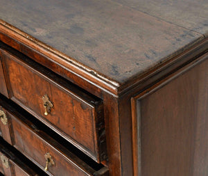 An oak and walnut chest of drawers