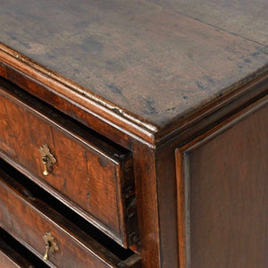 An oak and walnut chest of drawers