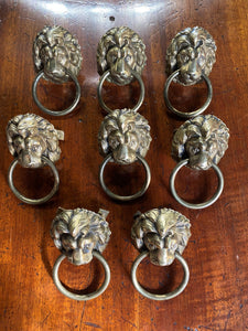A set of eight Lion Head draw pulls