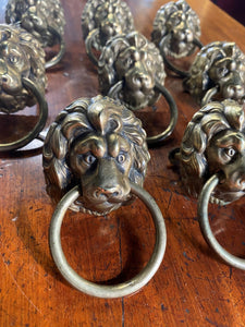 A set of eight Lion Head draw pulls