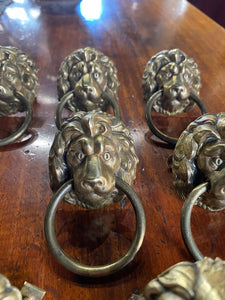 A set of eight Lion Head draw pulls