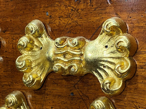 A set of Eight Lead Gold Leaf Appliqués