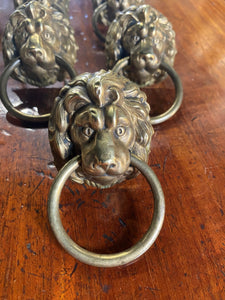A set of eight Lion Head draw pulls