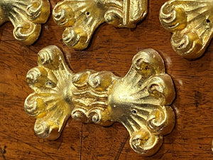 A set of Eight Lead Gold Leaf Appliqués