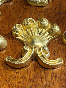A set of Eight Lead Gold Leaf Appliqués