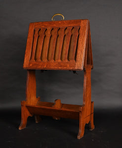 A folding Caxton in the manner of Liberty & Co.