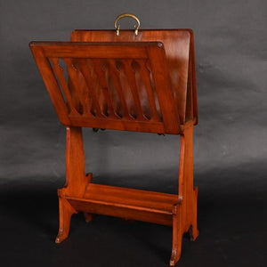 Oak folding Caxton in the manner of Liberty & Co.