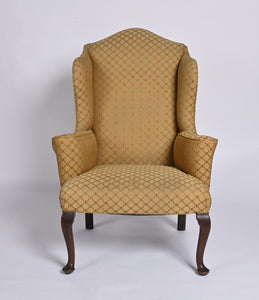 Queen Anne Style Upholstered Winged Armchair Of Generous Proportions.