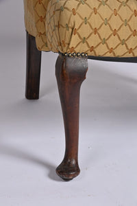 Queen Anne Style Upholstered Winged Armchair Of Generous Proportions.
