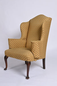 Queen Anne Style Upholstered Winged Armchair Of Generous Proportions.