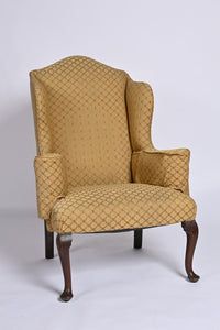 Queen Anne Style Upholstered Winged Armchair Of Generous Proportions.