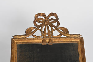 French Wall Mirror With Exceptional Foxed Plate And Cheeky Swag Detail.
