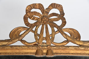 French Wall Mirror With Exceptional Foxed Plate And Cheeky Swag Detail.