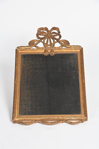 French Wall Mirror With Exceptional Foxed Plate And Cheeky Swag Detail.