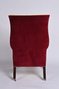 A Very Smart Wingback Armchair With Ball And Claw Feet And Brass Castors