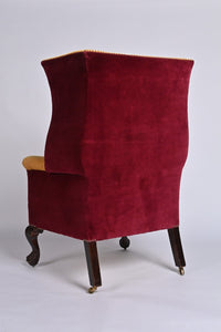 A Very Smart Wingback Armchair With Ball And Claw Feet And Brass Castors