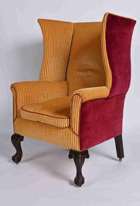 A Very Smart Wingback Armchair With Ball And Claw Feet And Brass Castors